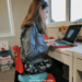 Girl on wobble cushion_example of alternative seating or chairs for kids with ADHD